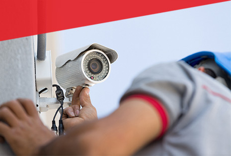 Man installing outdoor security camera in Salt Lake City